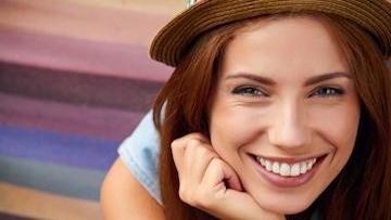 woman smiling | porcelain veneers huntsville al