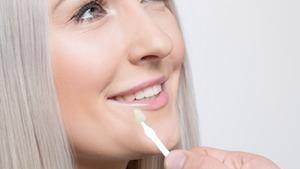 woman picking veneers l veneers huntsville al