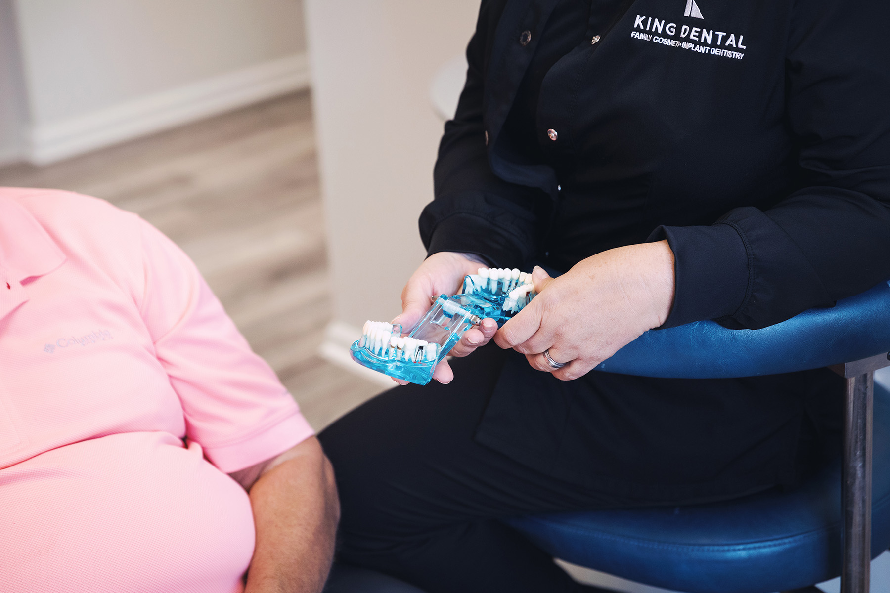 Man looking at dentures in Huntsville | Dentures Near Me