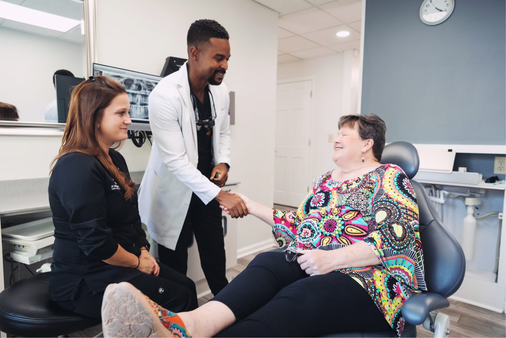 Dr. King greeting an elderly patient