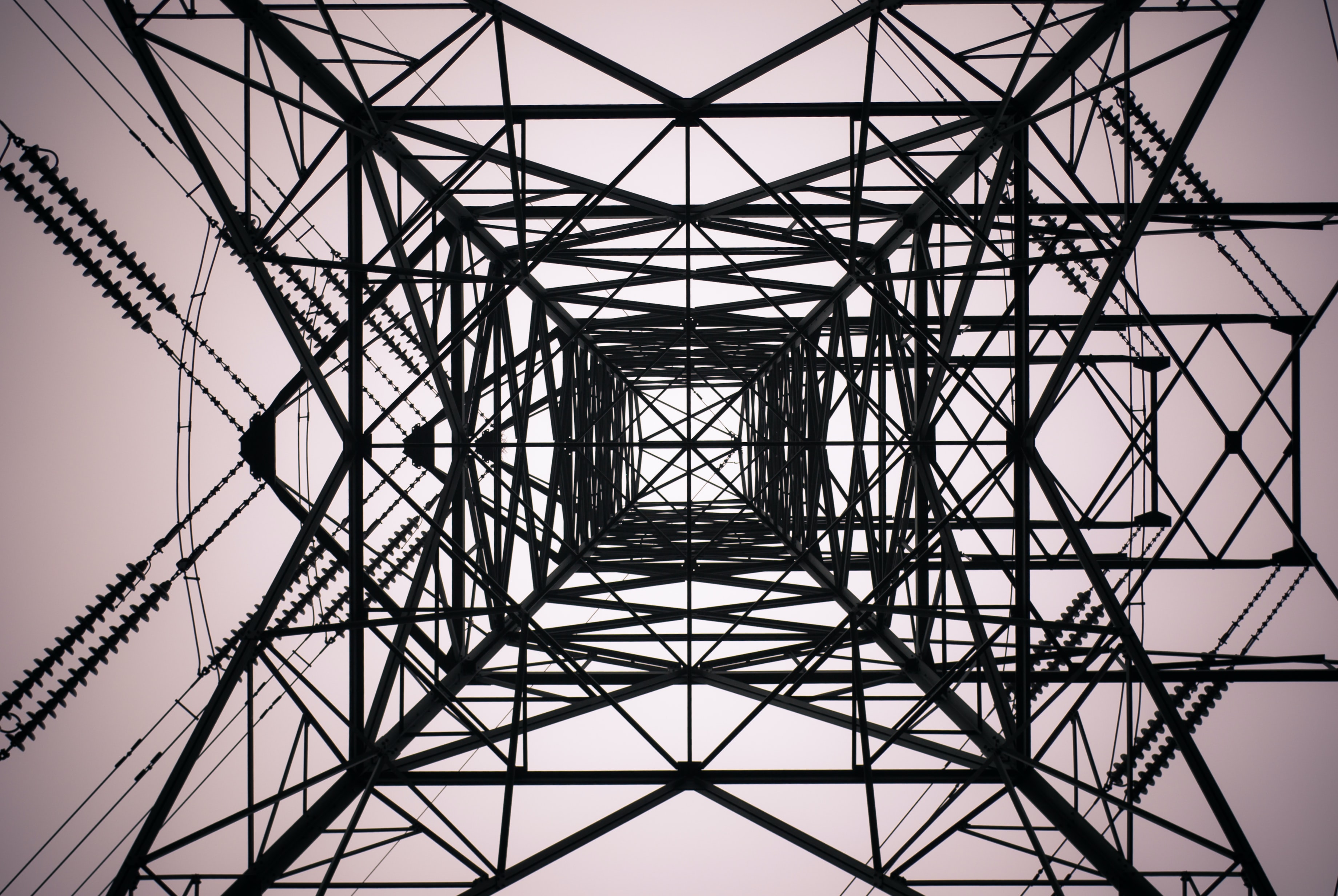 Abstract image of looking up from below a metal tower
