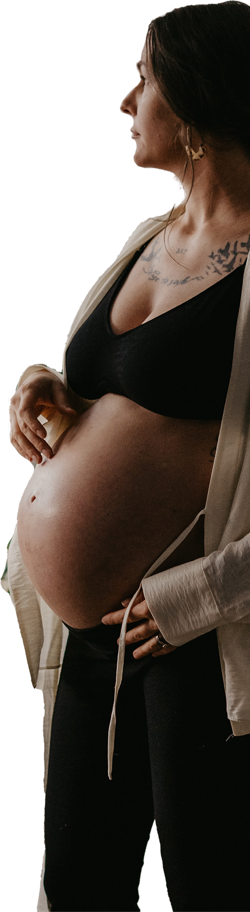 pregnant lady with pregnant belly on show looking to the side