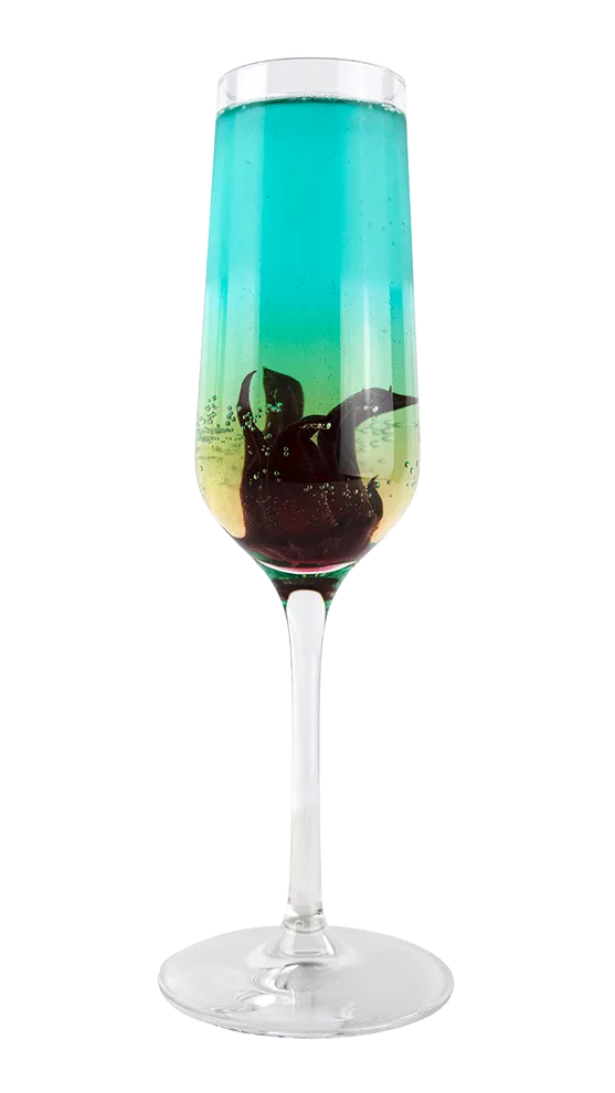 A hibiscus cocktail in a champagne glass