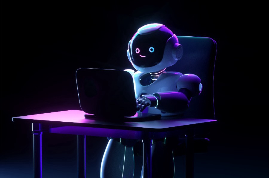 Robot behind laptop