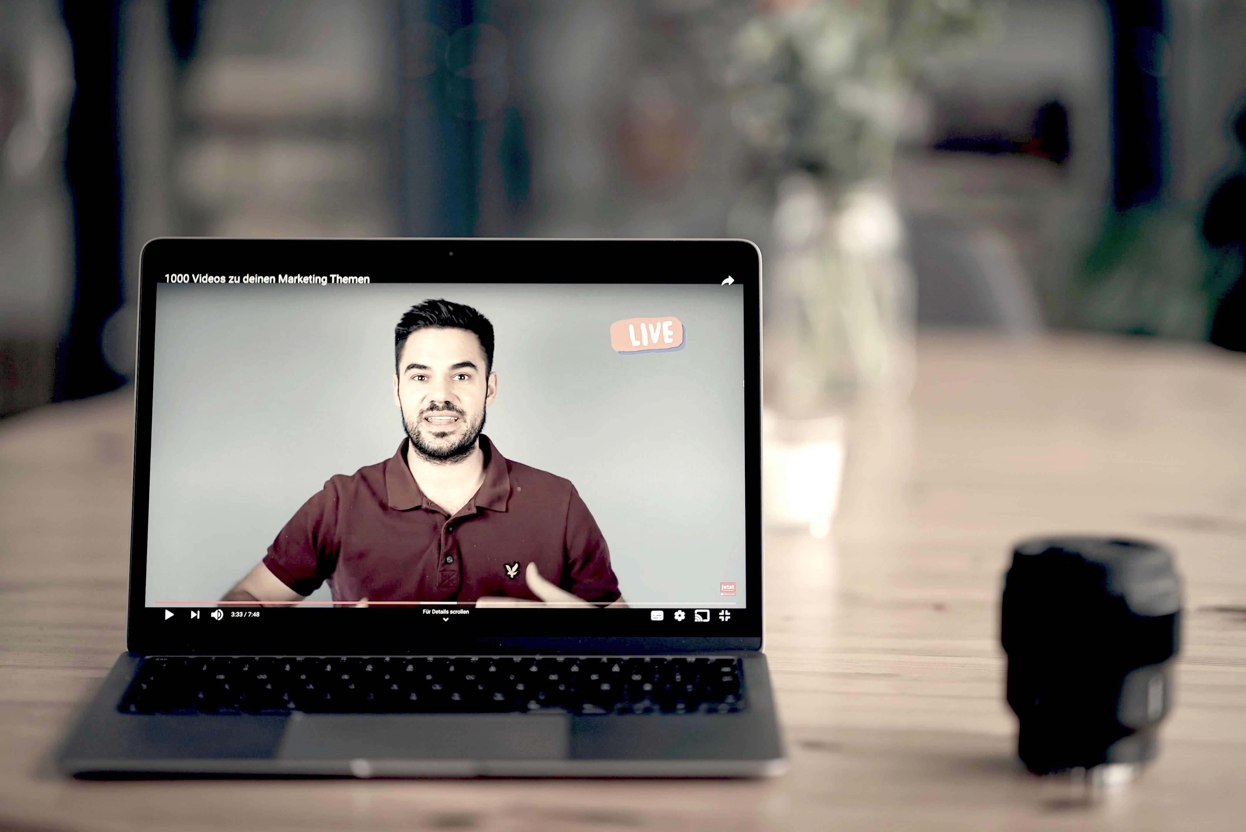 laptop showing man going live