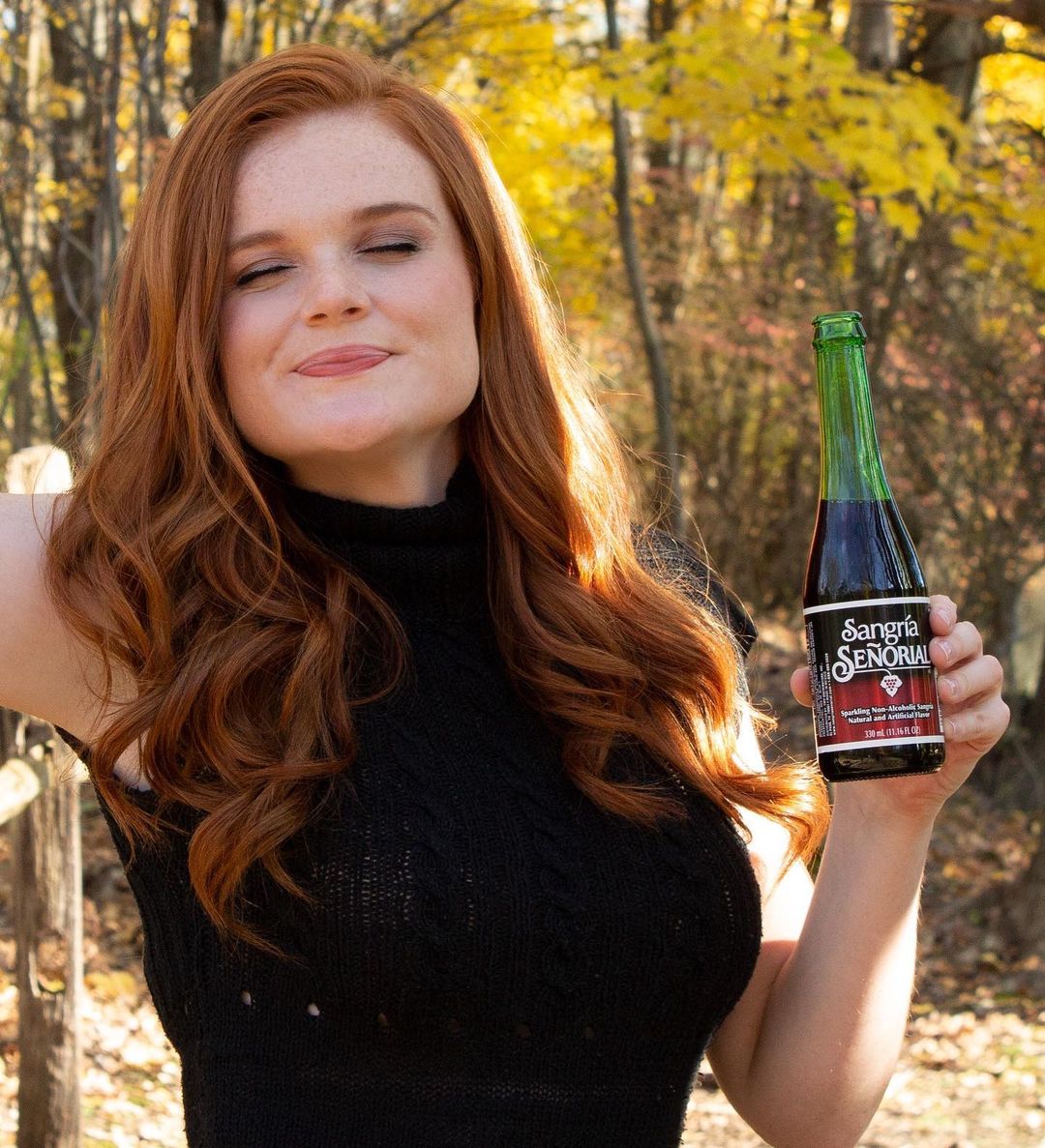 woman promoting beverage