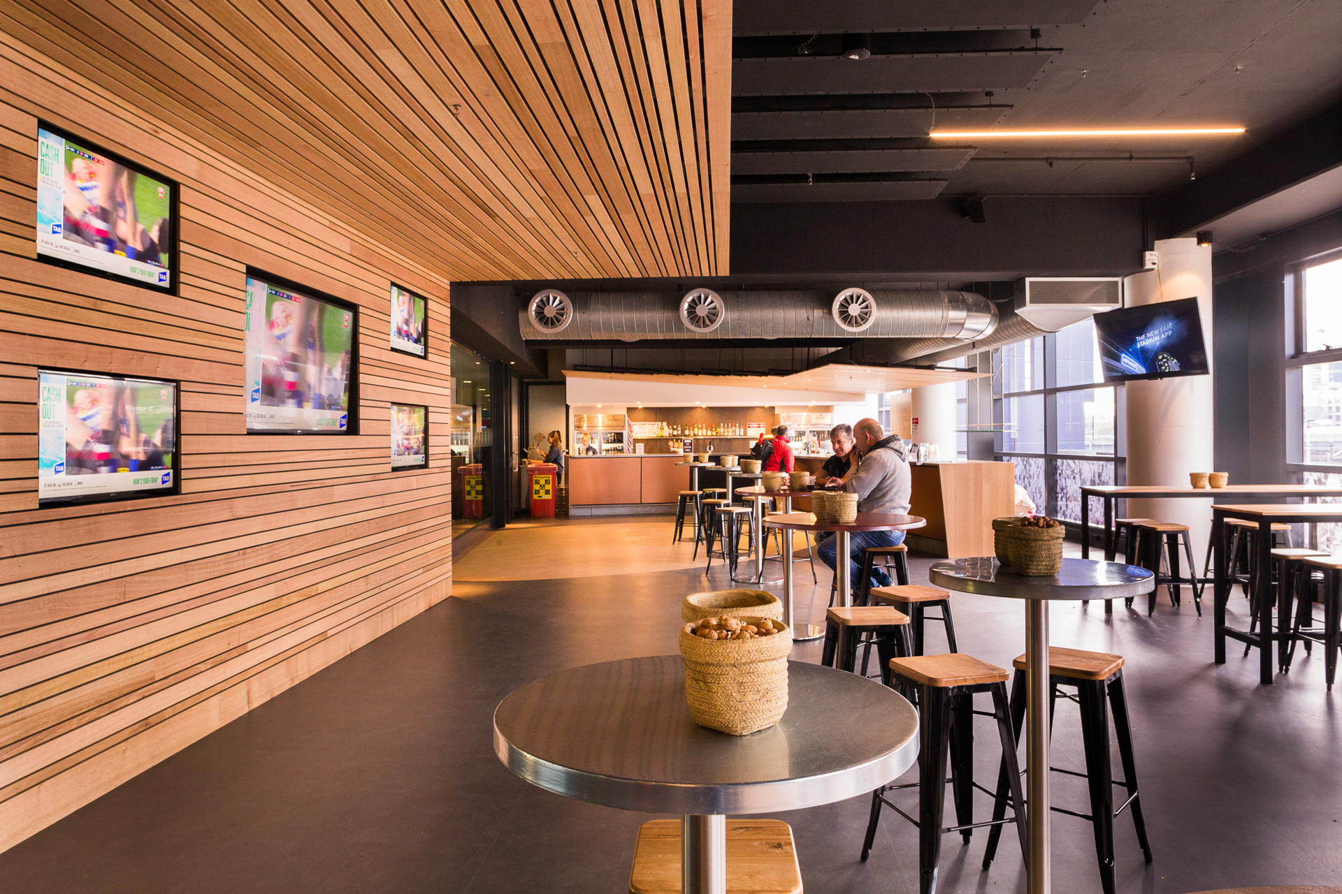 Marvel Stadium coaching boxes and new Centre Wing Bar designed by Crosier Scott Architects.