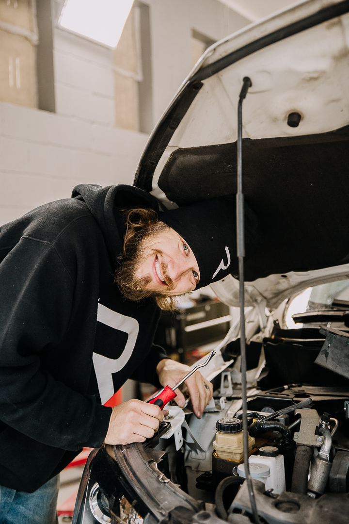 Reverse Collision Tech Doing Front-End Repair