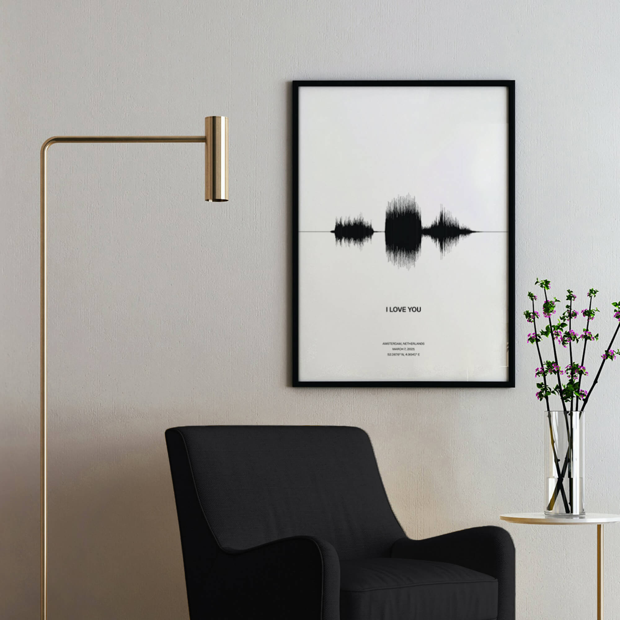 A white poster inside a black frame. The poster depicts a sound-wave of the phrase "I love you". Recorded for valentine and includes an audio caption, location and date of the recording.