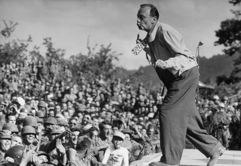 Jack Benny performing for troops in Korea.