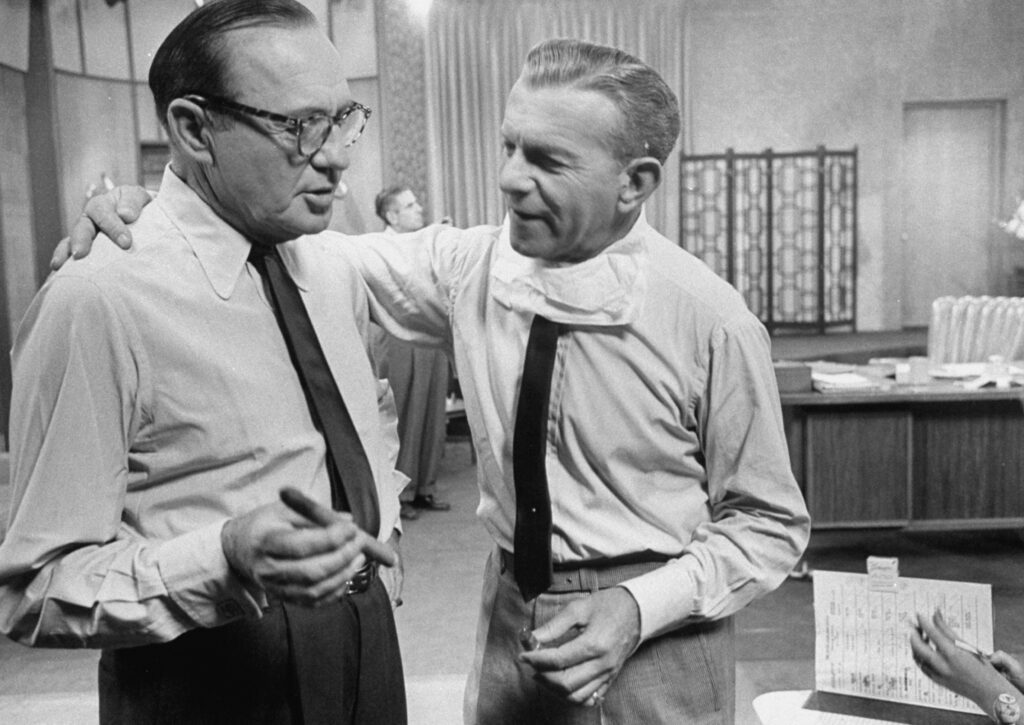 George Burns and Jack Benny talking.