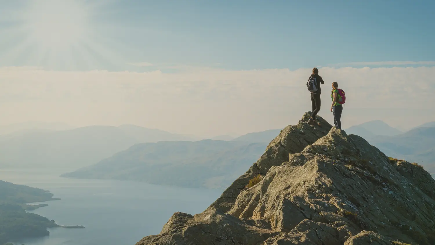 Two hikers on a mountain top